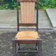 4 Basque solid wood dining chairs with carved straw seats.