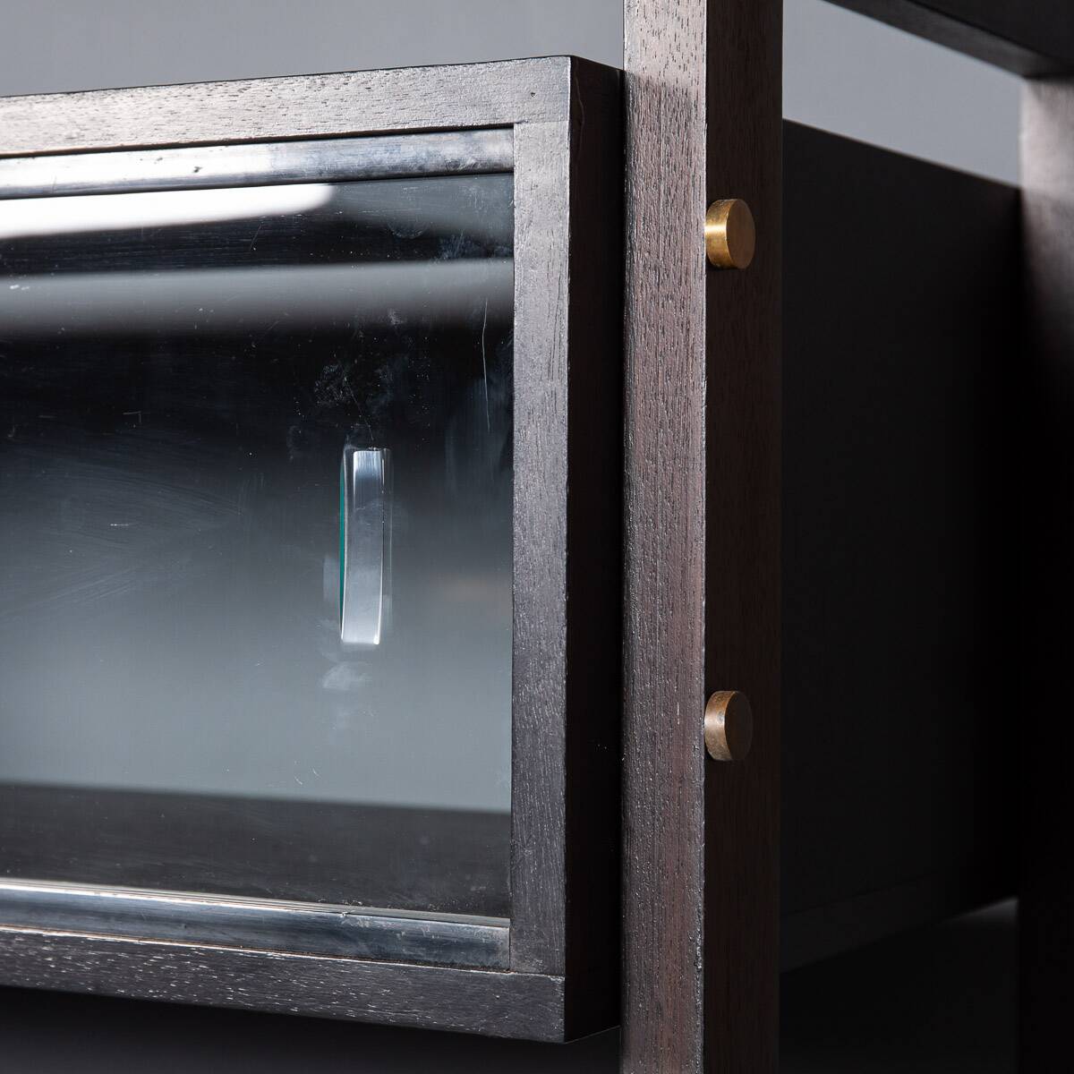 Striking 20thc italian ebonised etageres with open back & storage c.1970