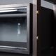 Striking 20thc italian ebonised etageres with open back & storage c.1970