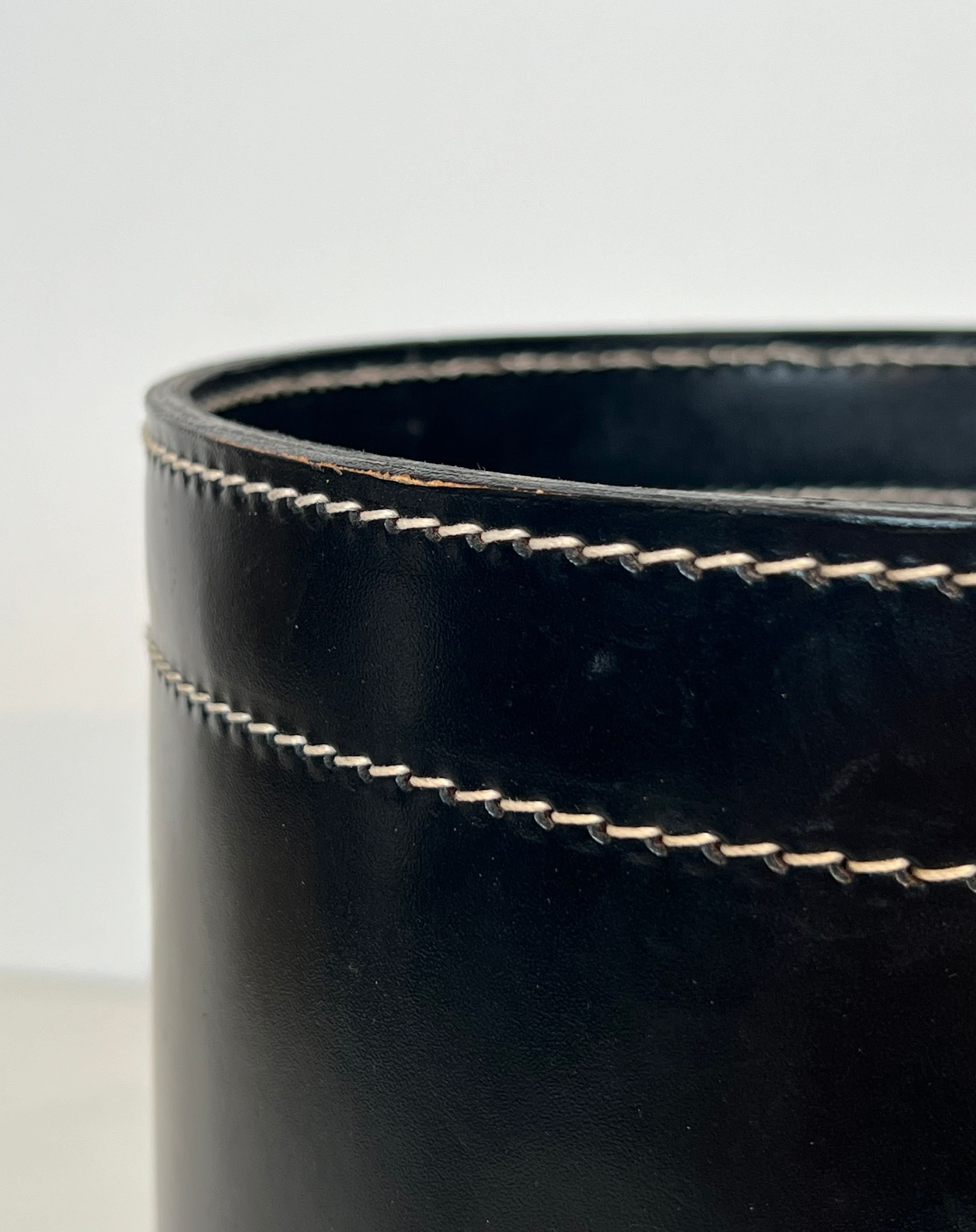 Black leather and brass desk basket