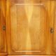 Vintage buffet made of mottled yew wood with three doors and four drawers.