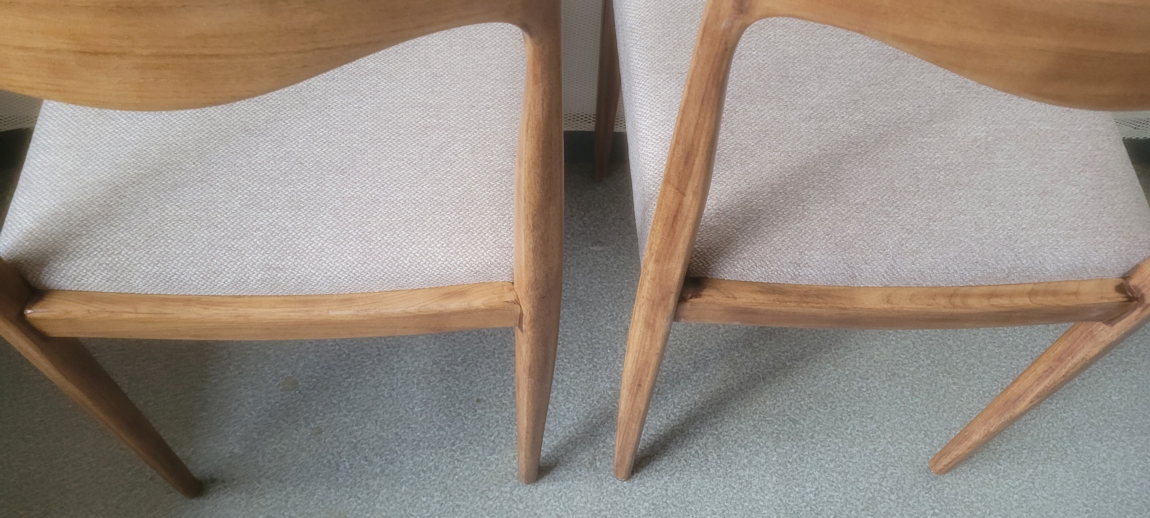 Pair of Scandinavian teak chairs sitting beige gray fabric
