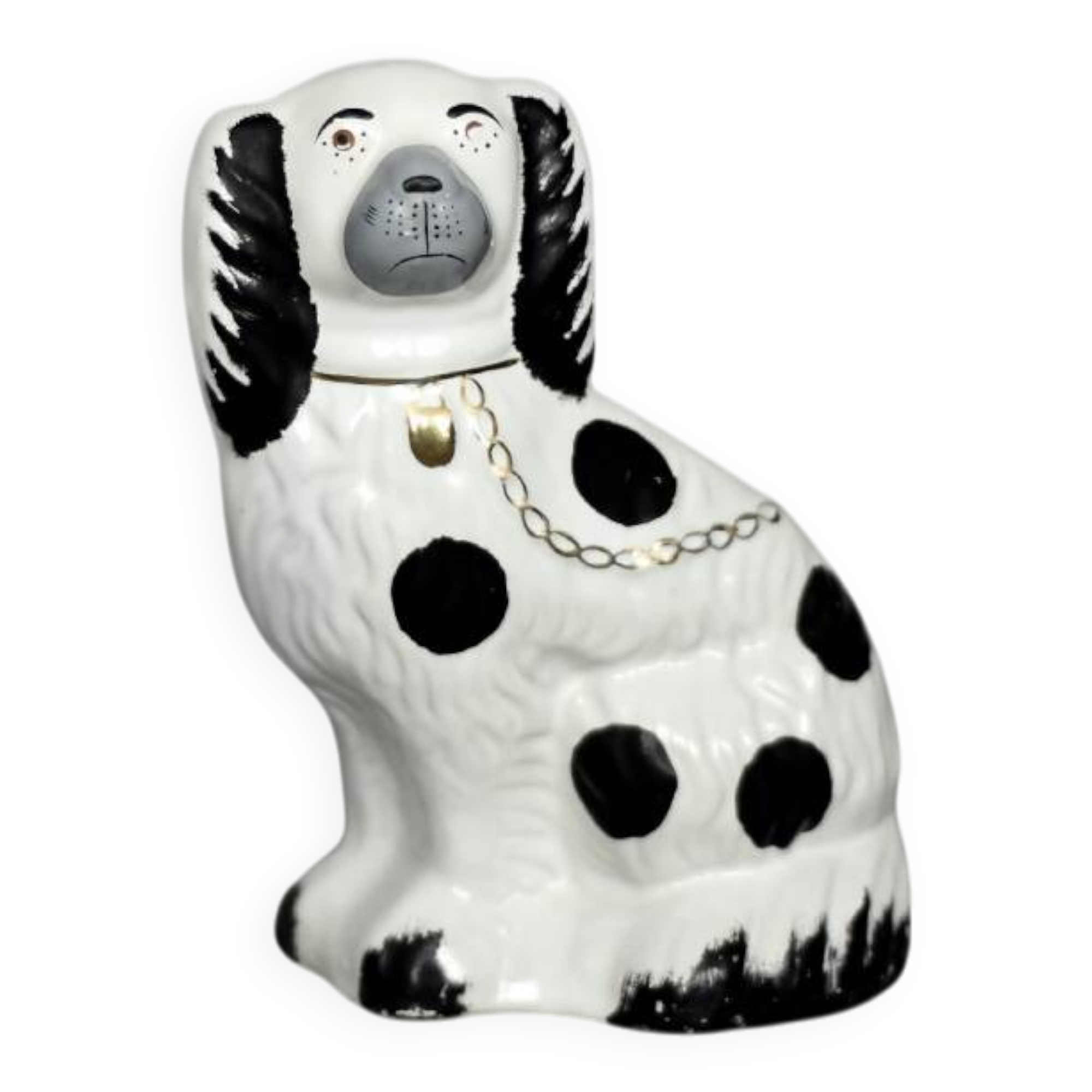Vintage ceramic figurine from Staffordshire depicting a spaniel dog, England.