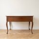 Retro wooden desk with curved legs