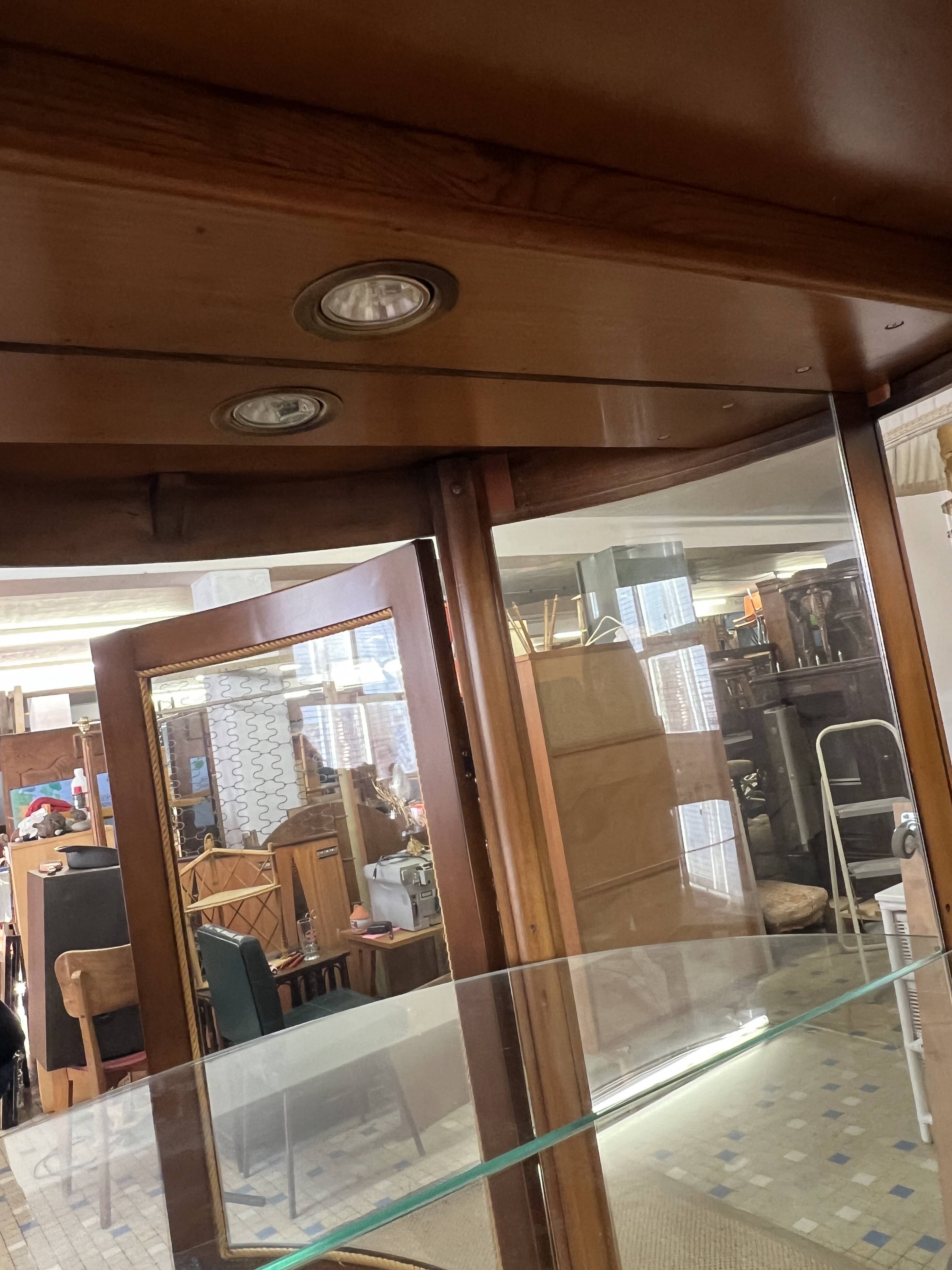 Wooden display case and half-moon mirror