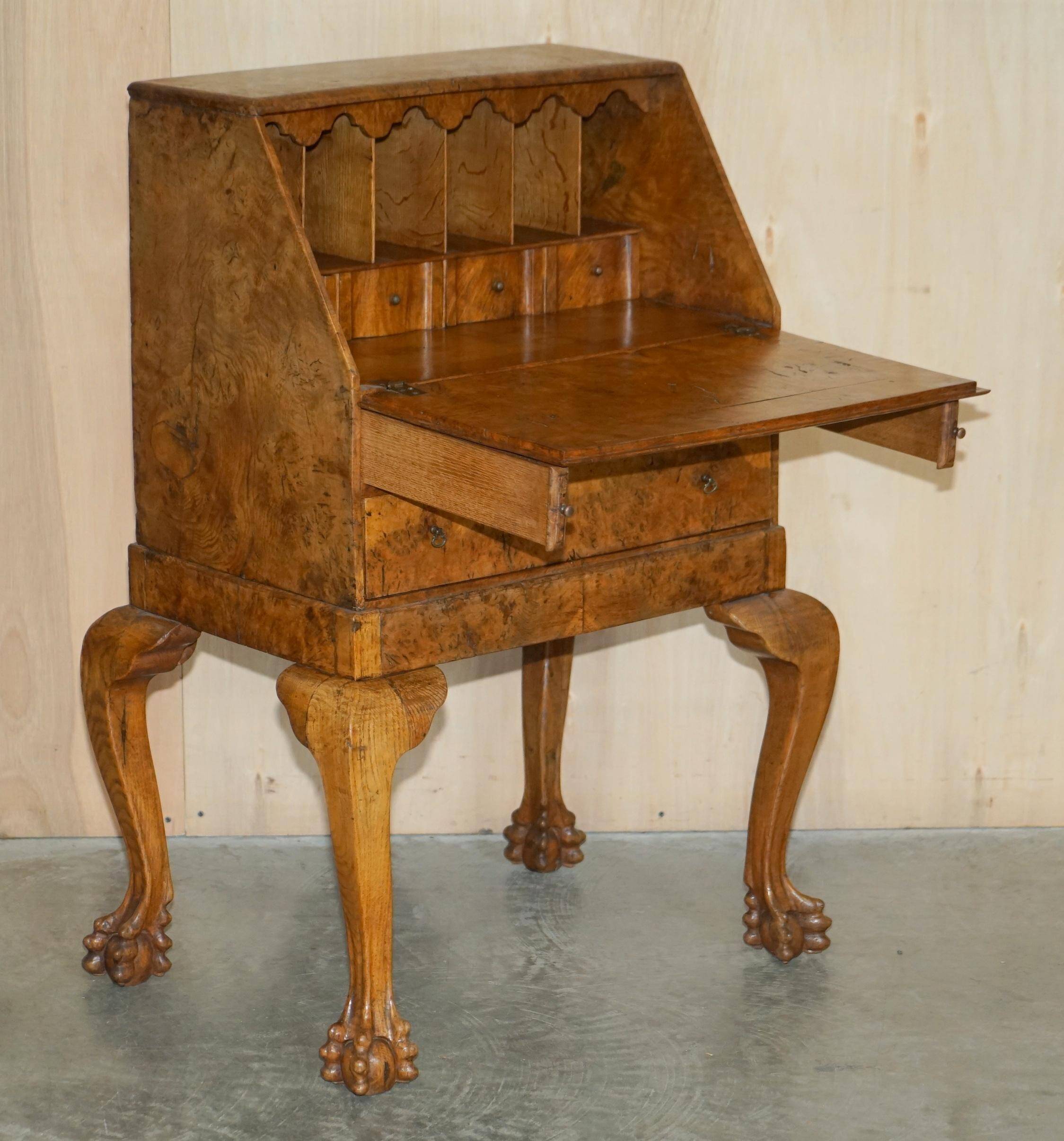 Writing desk in pollard oak from around 1800 with claw and ball carved legs.