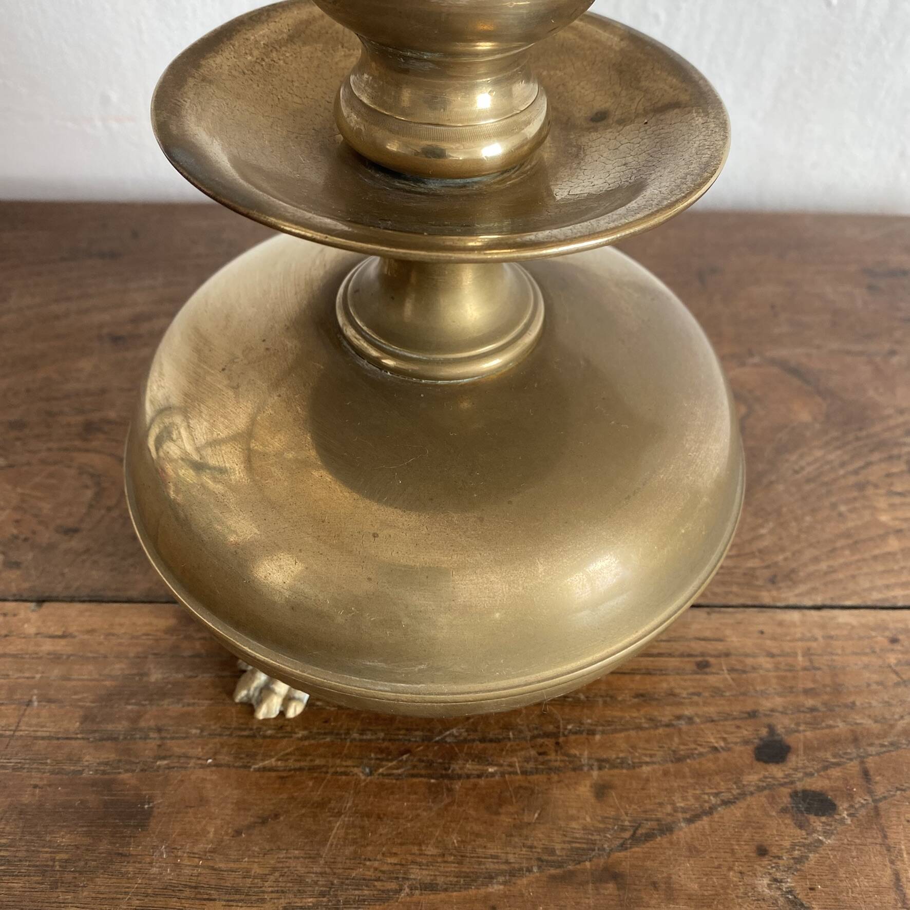 Antique brass lamp with embroidered openwork shade.