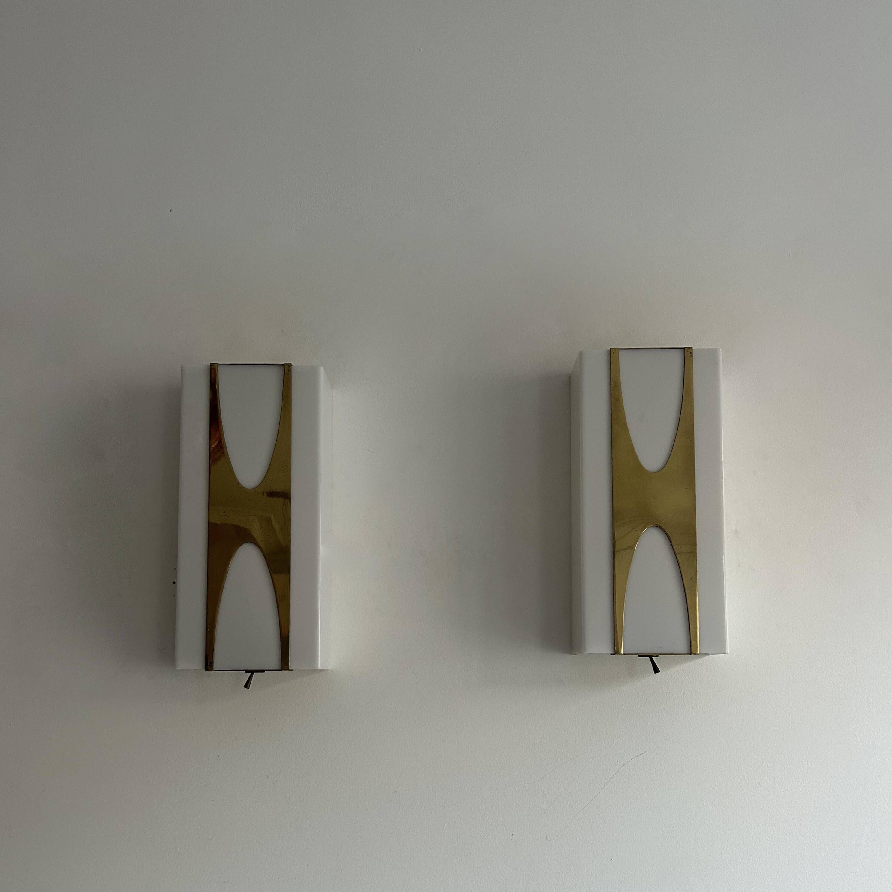 Pair of Loewy wall lights for Hilton, brass and Perspex, France 1965