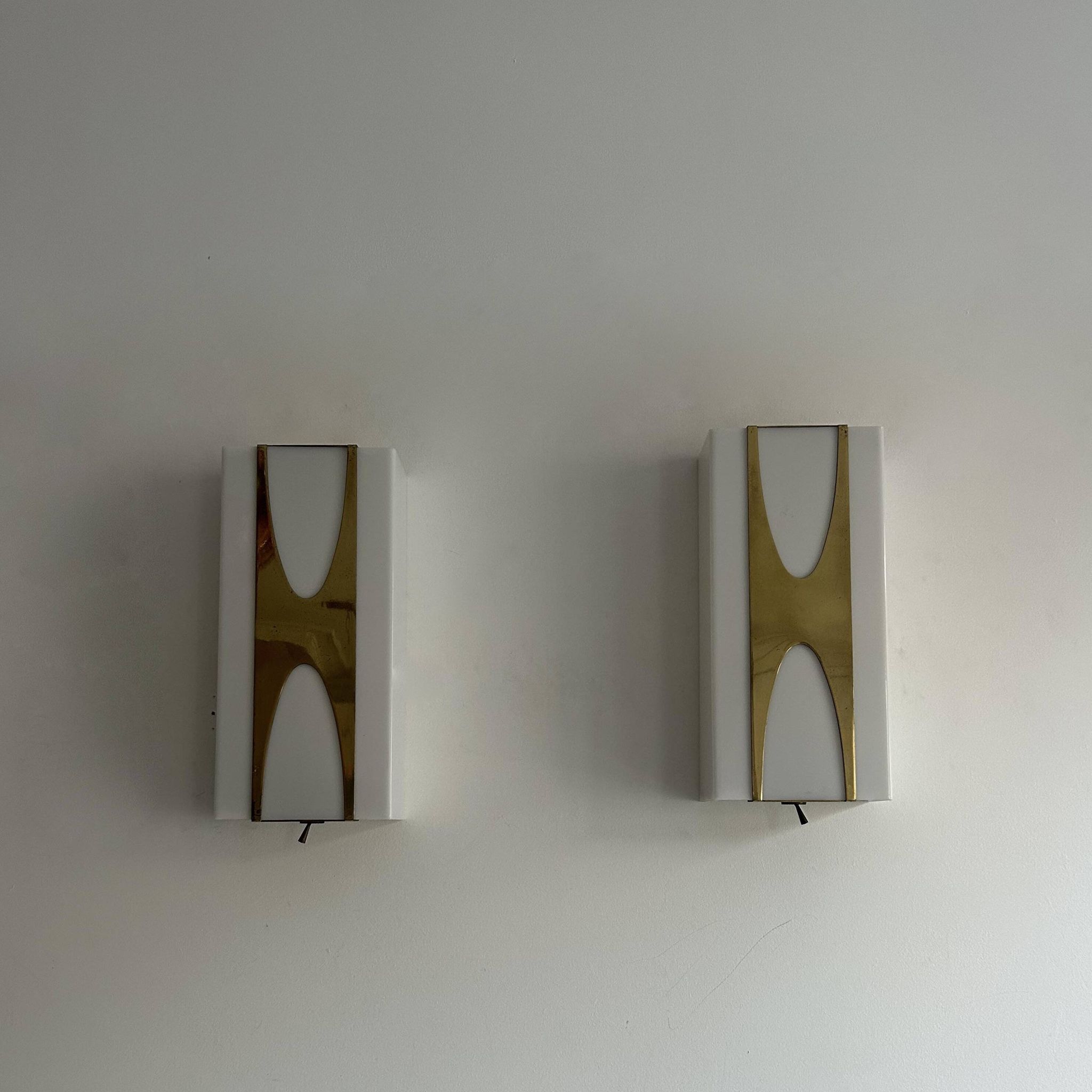 Pair of Loewy wall lights for Hilton, brass and Perspex, France 1965
