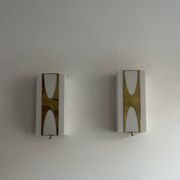 Pair of Loewy wall lights for Hilton, brass and Perspex, France 1965