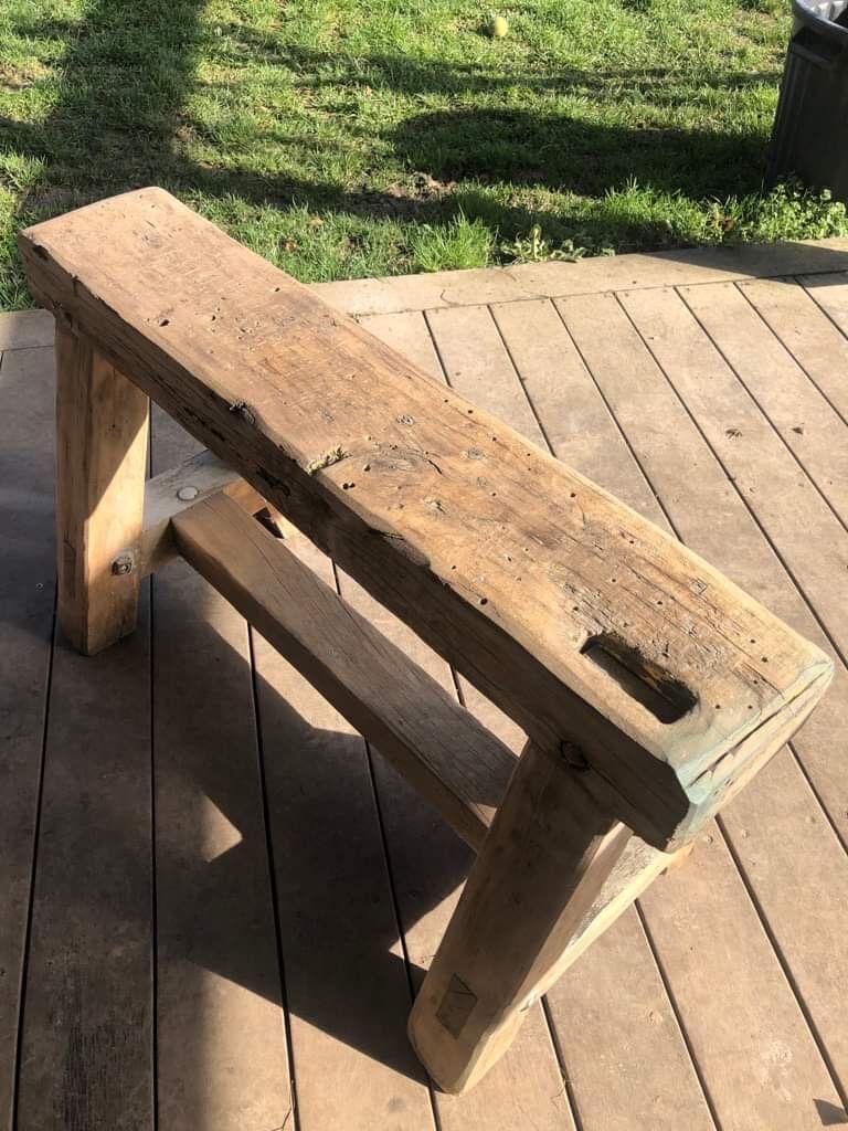 Trestle-shaped wooden bench