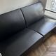 Sofa and armchair in Swedish black leather by Gunilla Allard for Lammhults.