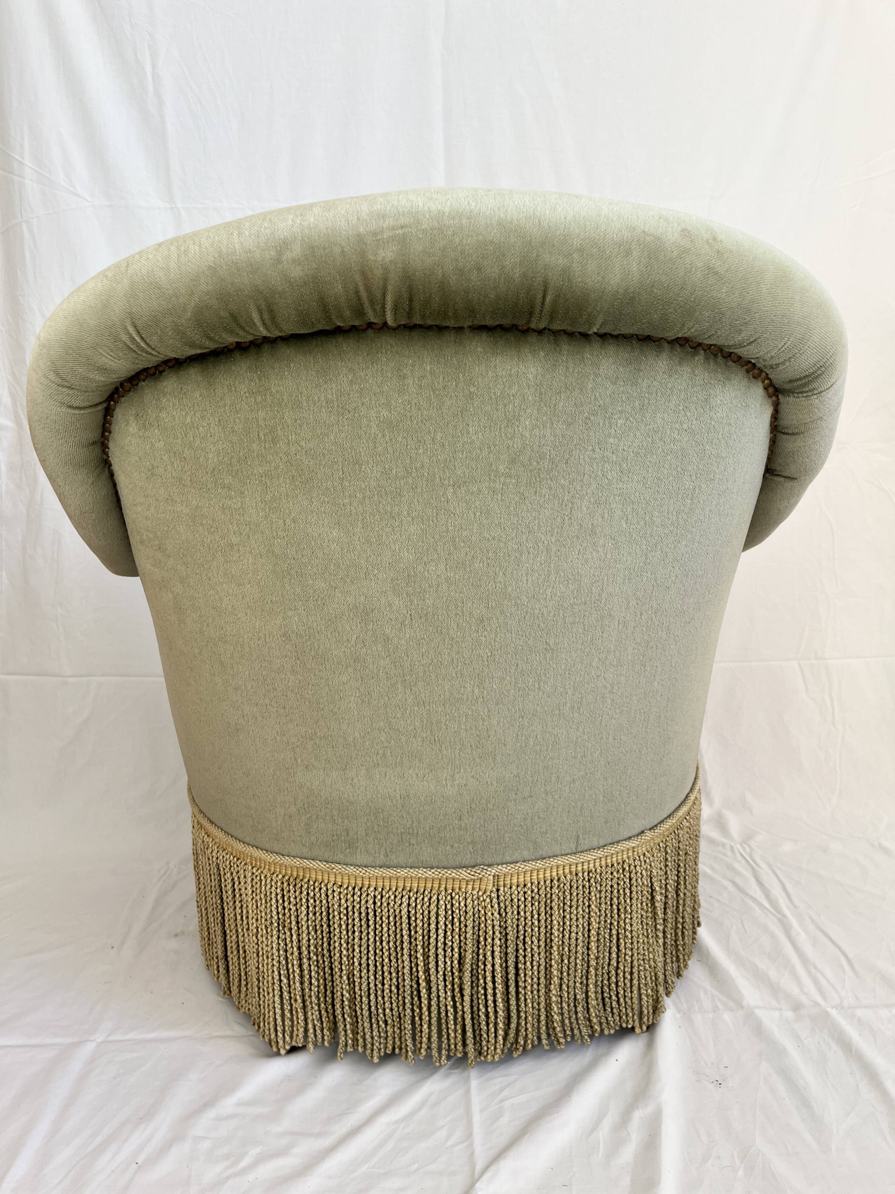 sage green toad armchairs with gold fringe