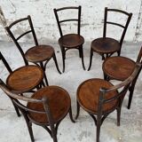 Série de 7 anciennes chaises bistrot Baumann bois courbé assise ronde
