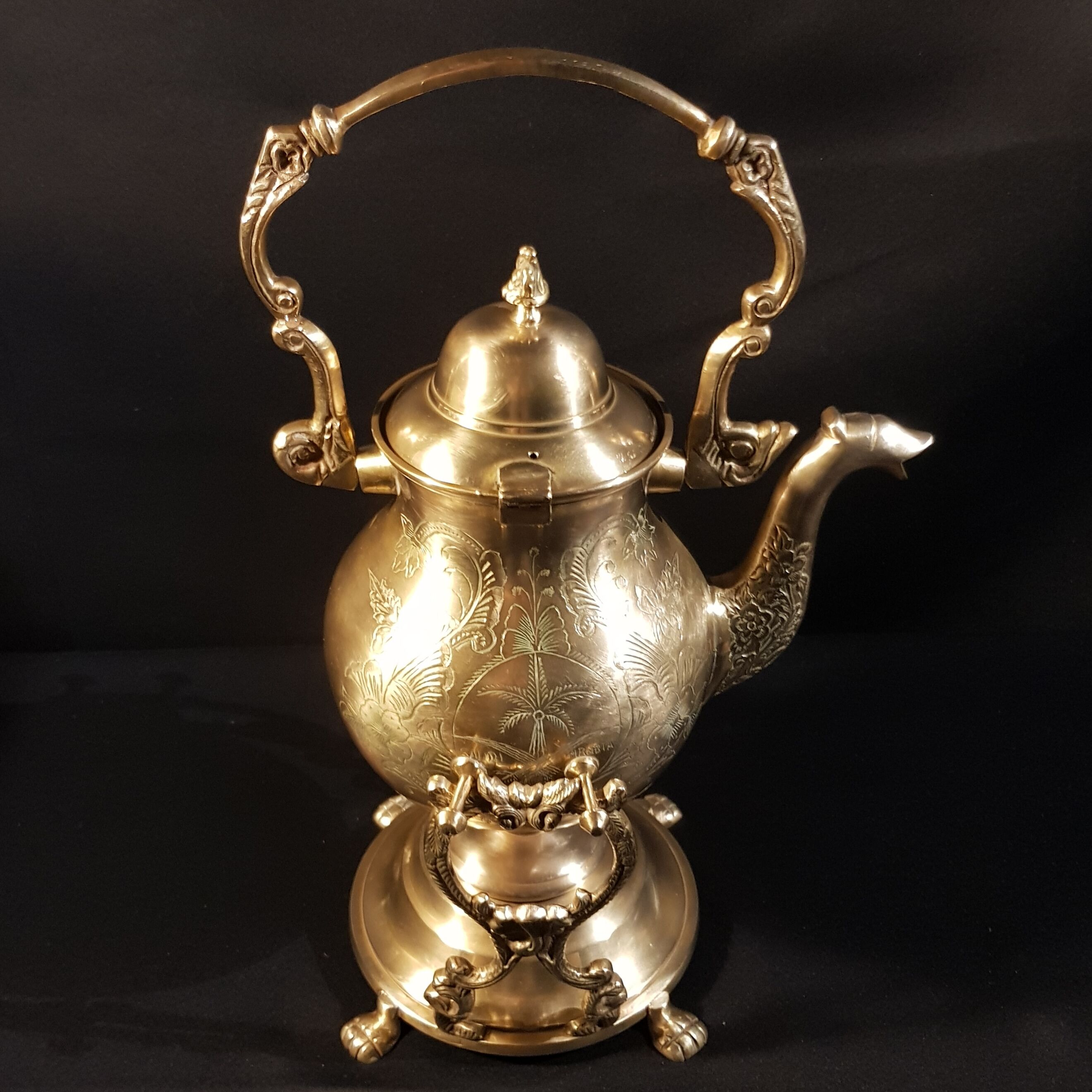 Oriental teapot on its support