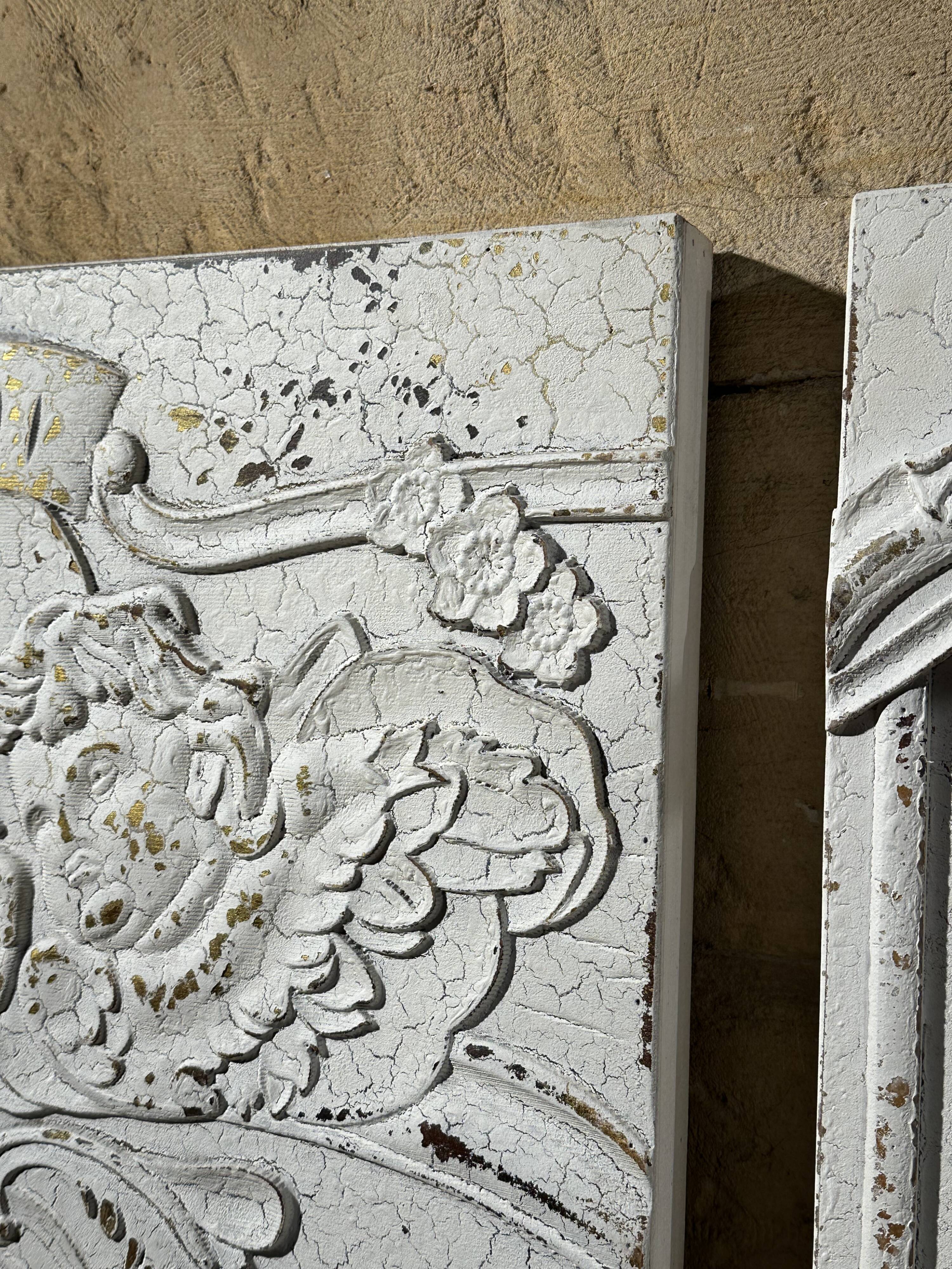 Wall decoration in three pieces, triptych of relief decoration on weathered wood, white and gold,