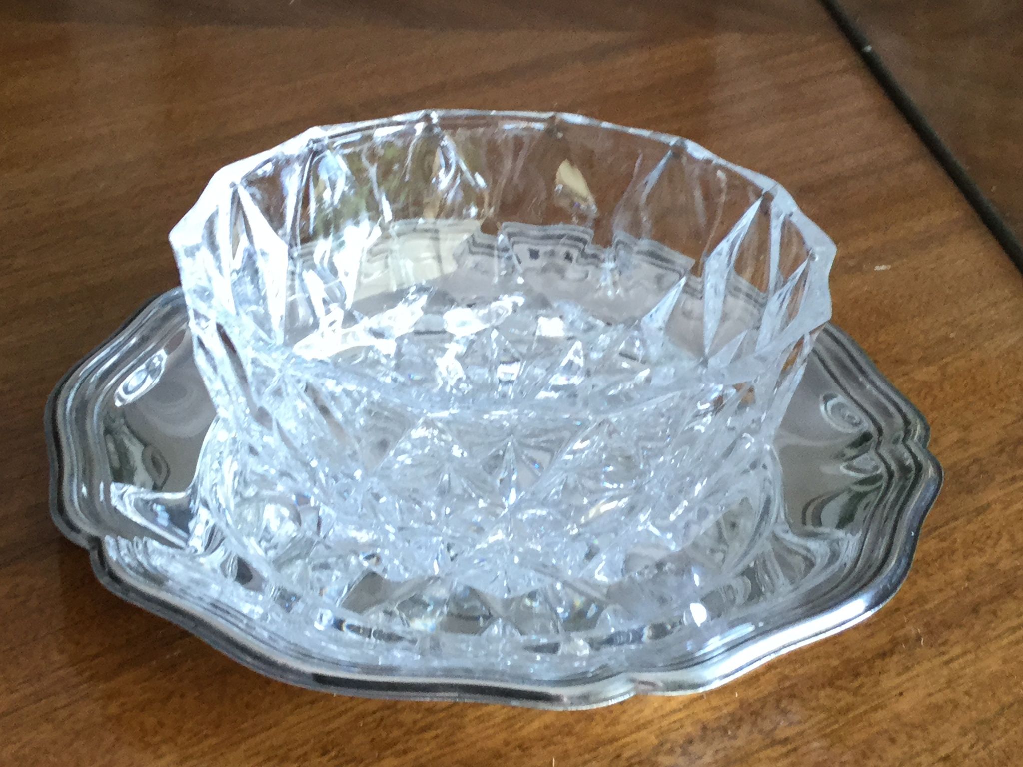 Crystal ravier on silver metal plate