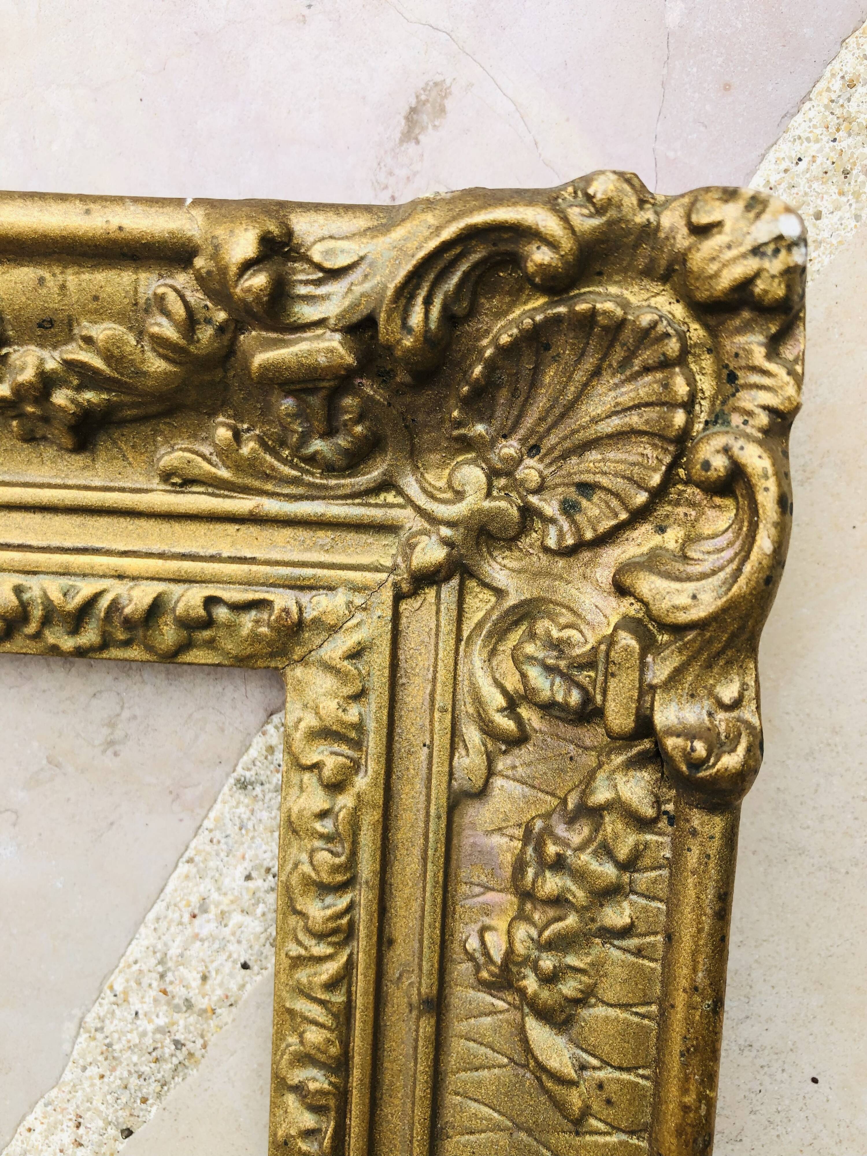 Old frame in gilded molded wood