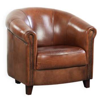 Vintage sheepskin club armchair in English style with deep colours