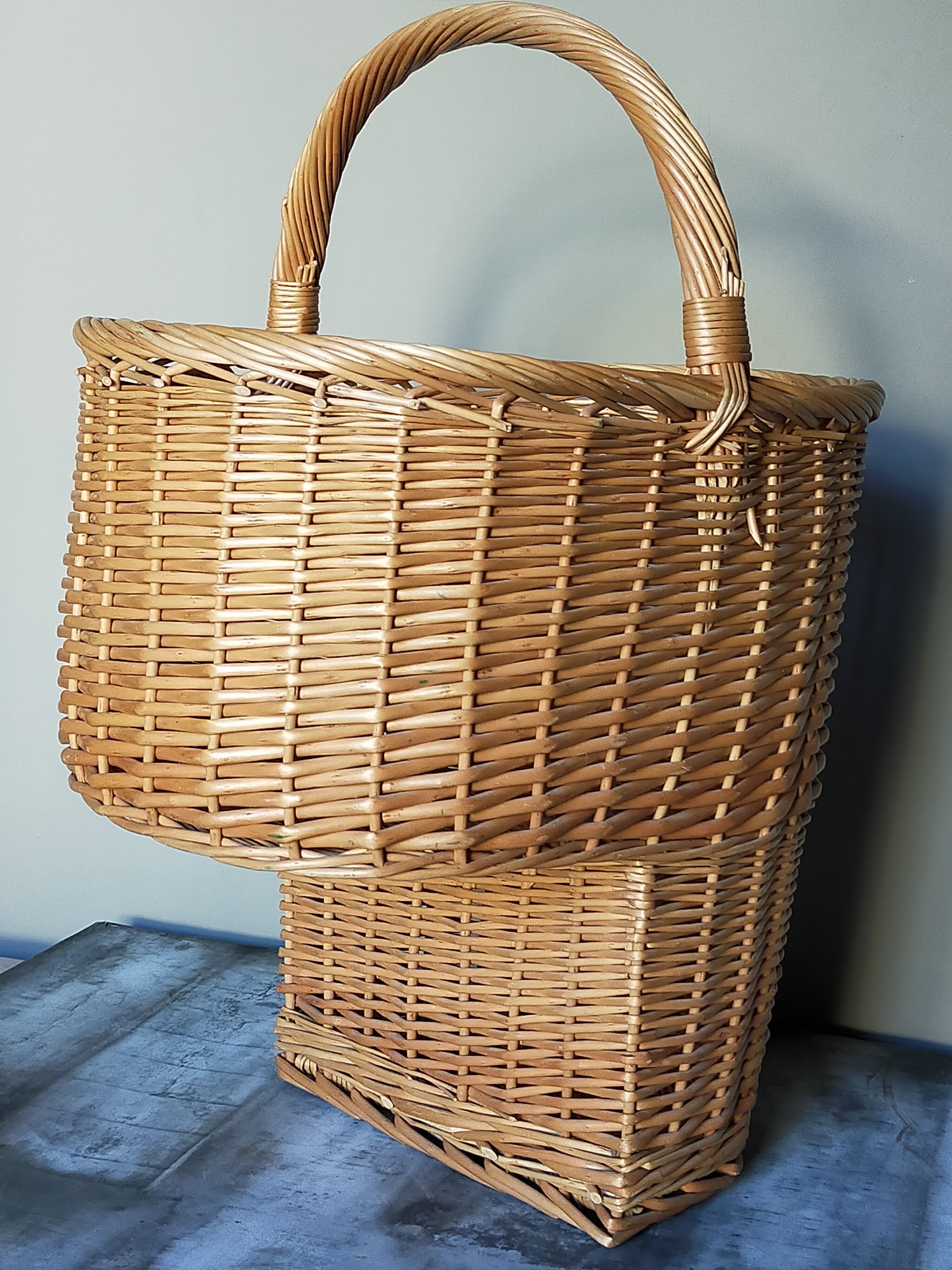 Asymmetrical woven rattan basket