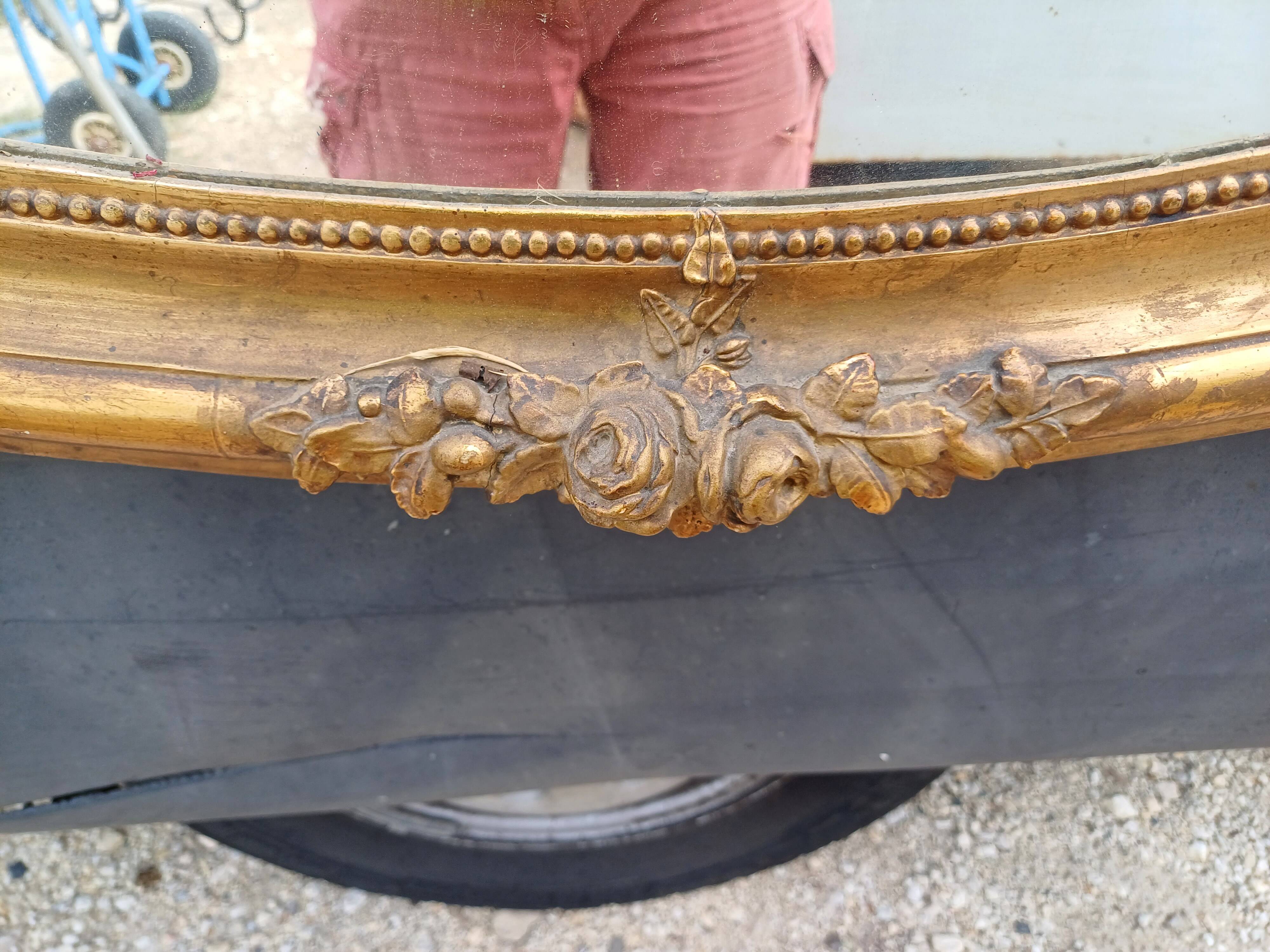 Oval mirror wood and gilded stucco 19th century