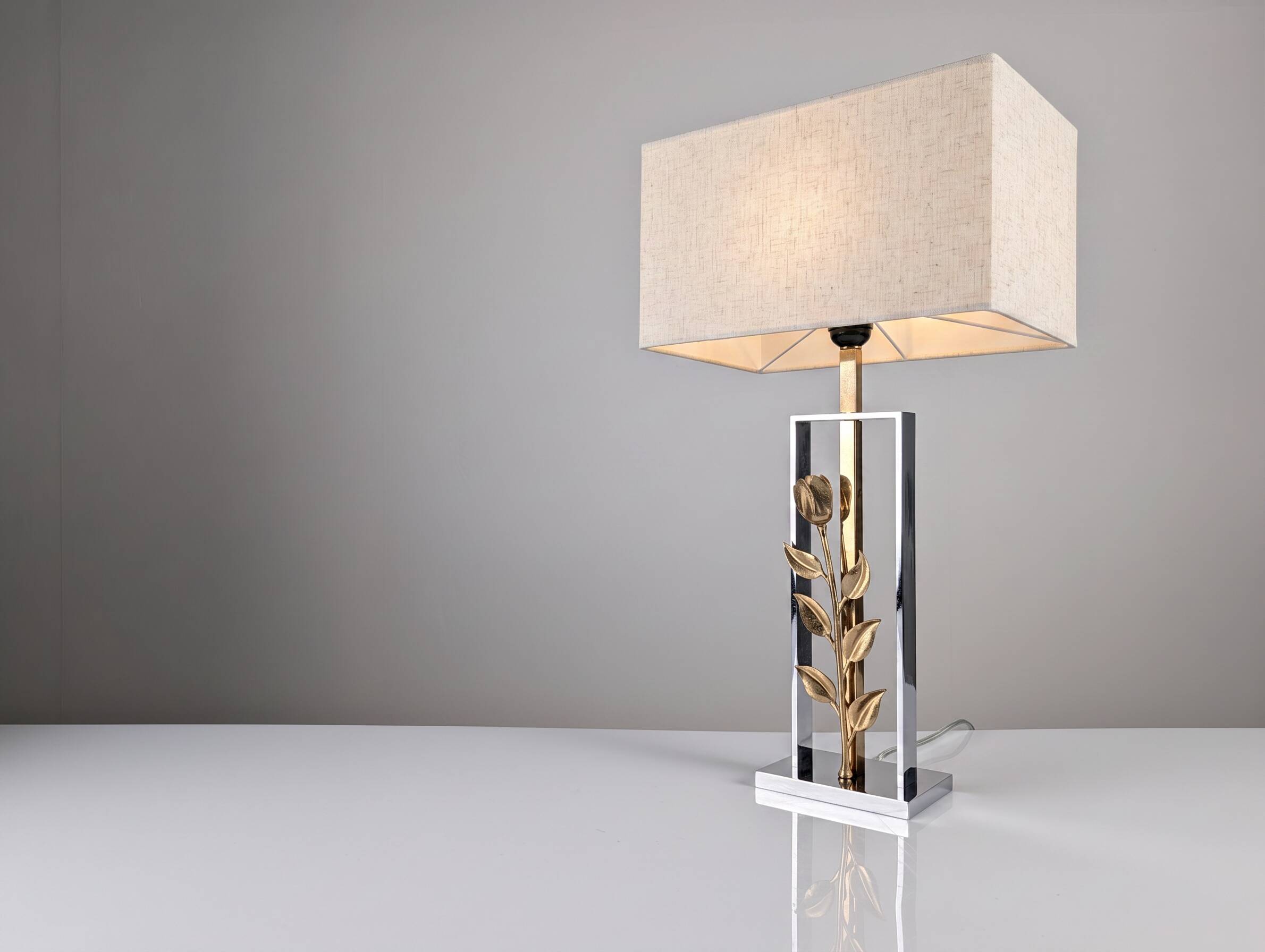 Maison Charles table lamp in chrome and gilt bronze with rose, France, 1970s