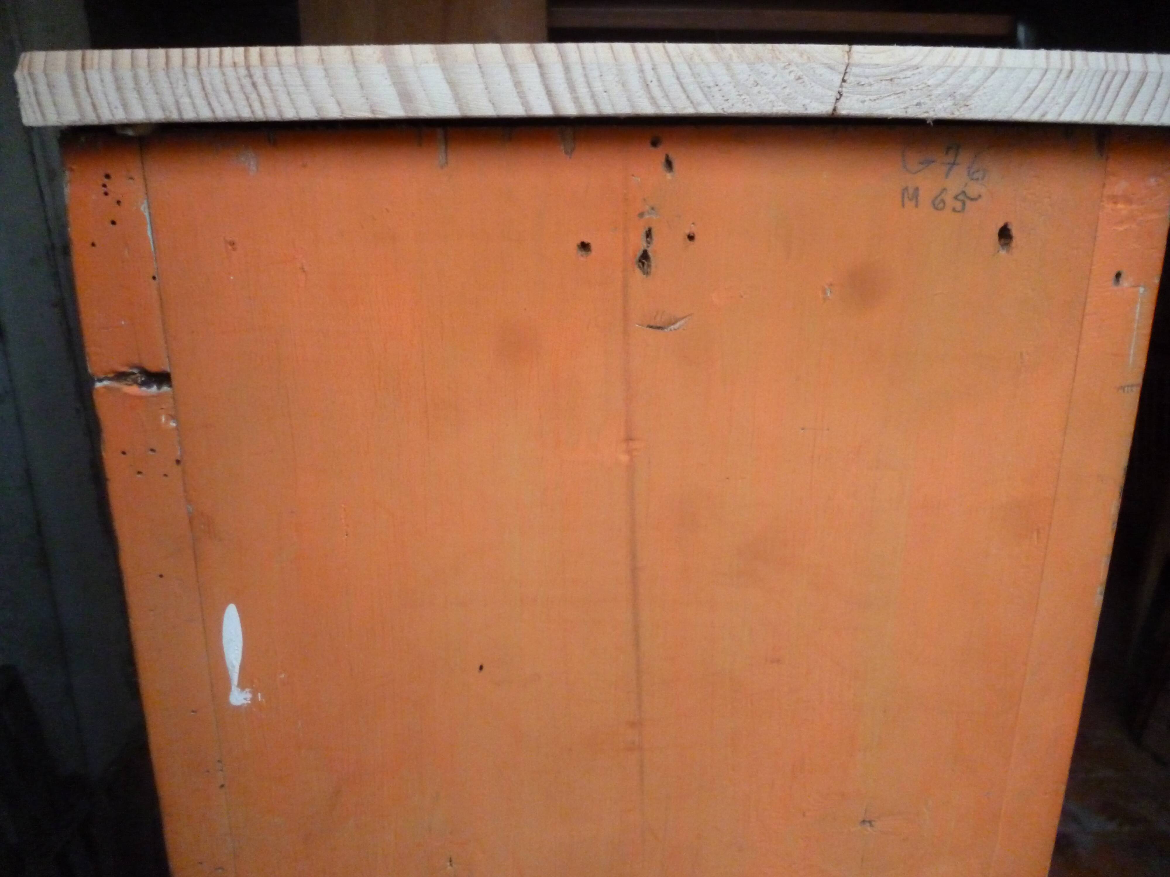 Small piece of furniture with orange patina