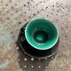 Coffee service composed of 5 cups and saucers in black earthenware and different colored interiors