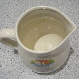 Retro pitcher with naive decorations