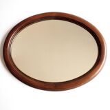 Oval mirror with wooden frame