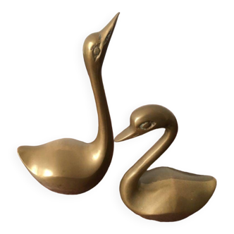 Couple of swans in gold metal
