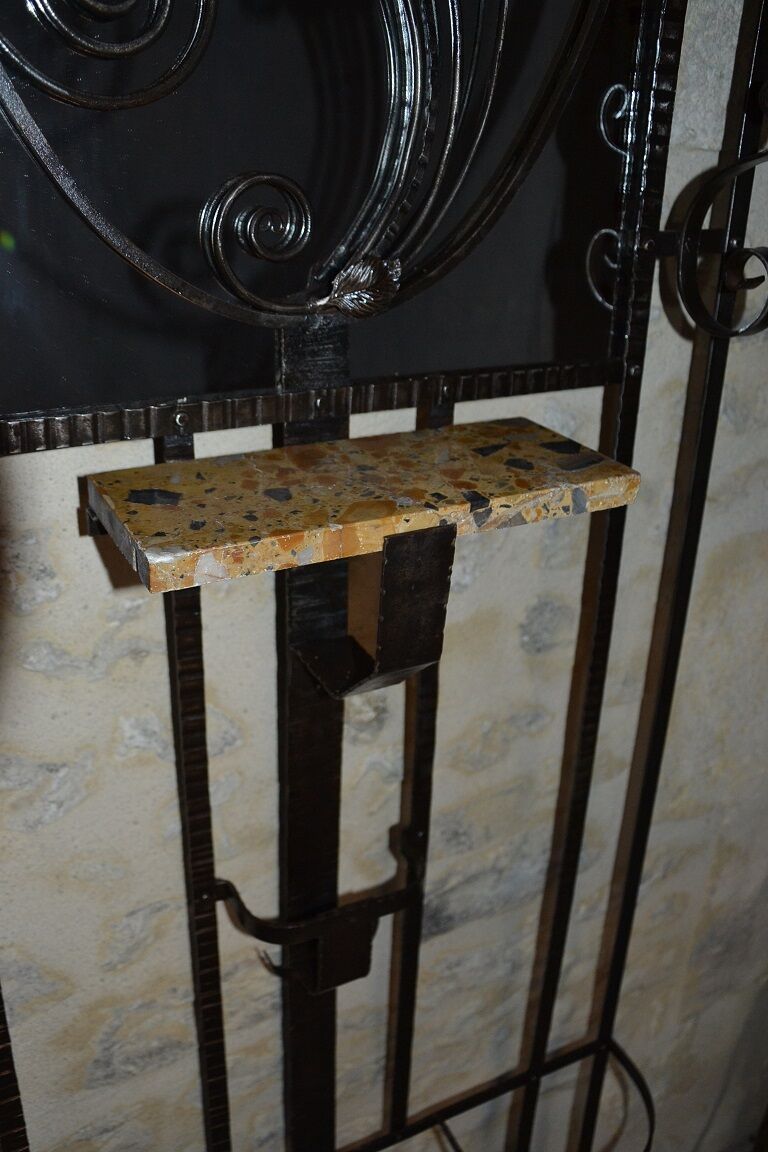 Wrought iron wardrobe with oval mirror