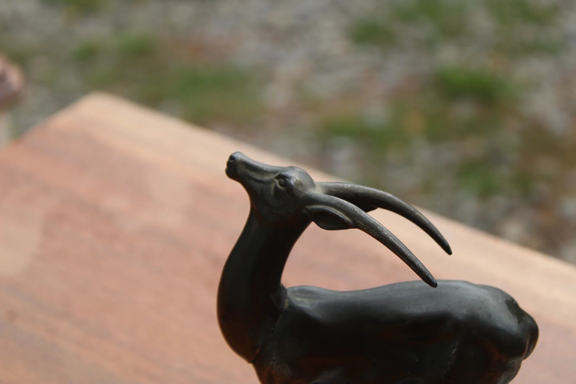 Vintage antelope gazelle bookend in patinated metal on a marble base.
