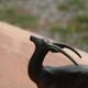 Vintage antelope gazelle bookend in patinated metal on a marble base.
