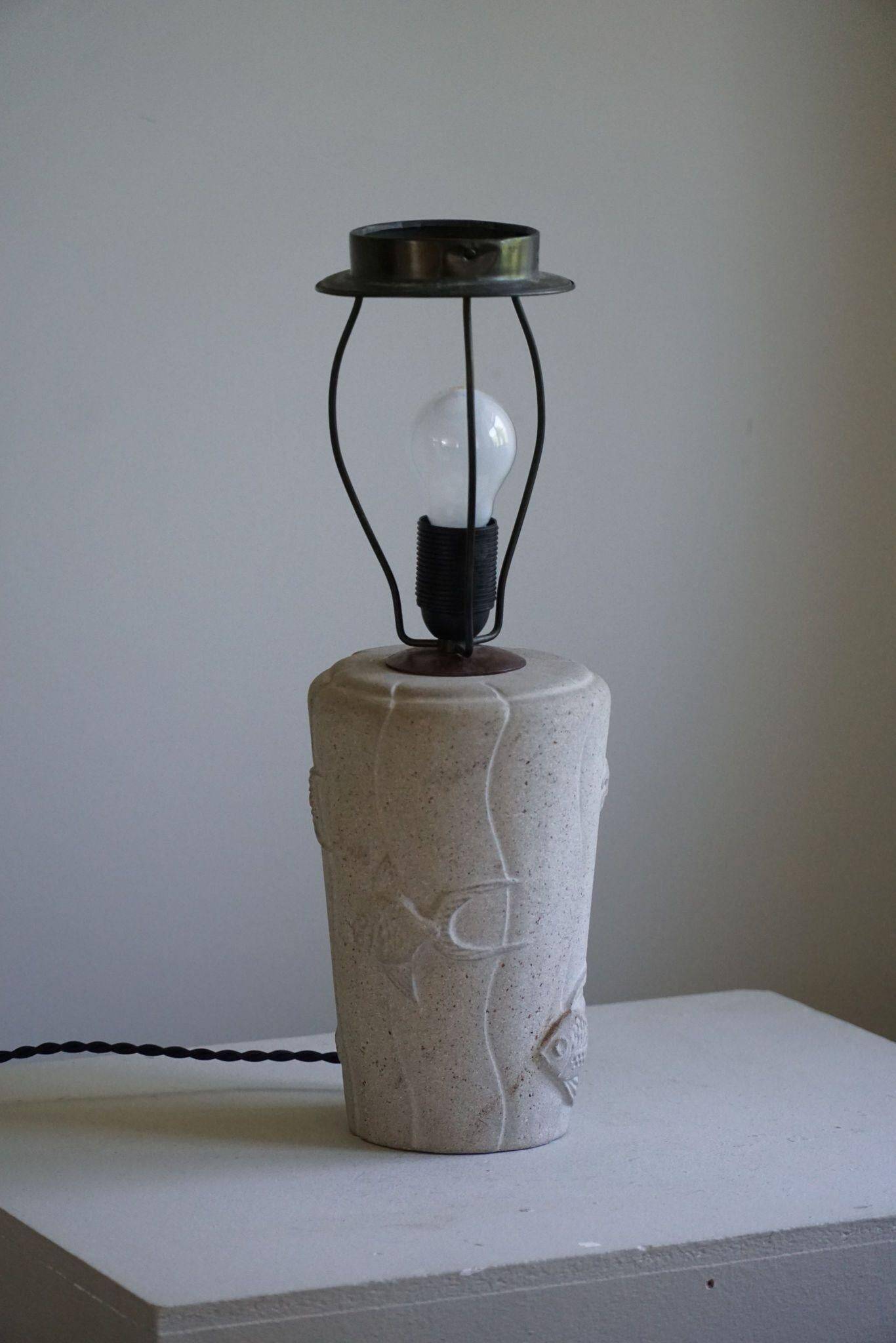 Modern vintage French table lamp, made of stone with fish patterns, 1970s.