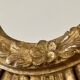 Large sun mirror in carved gilded wood.
