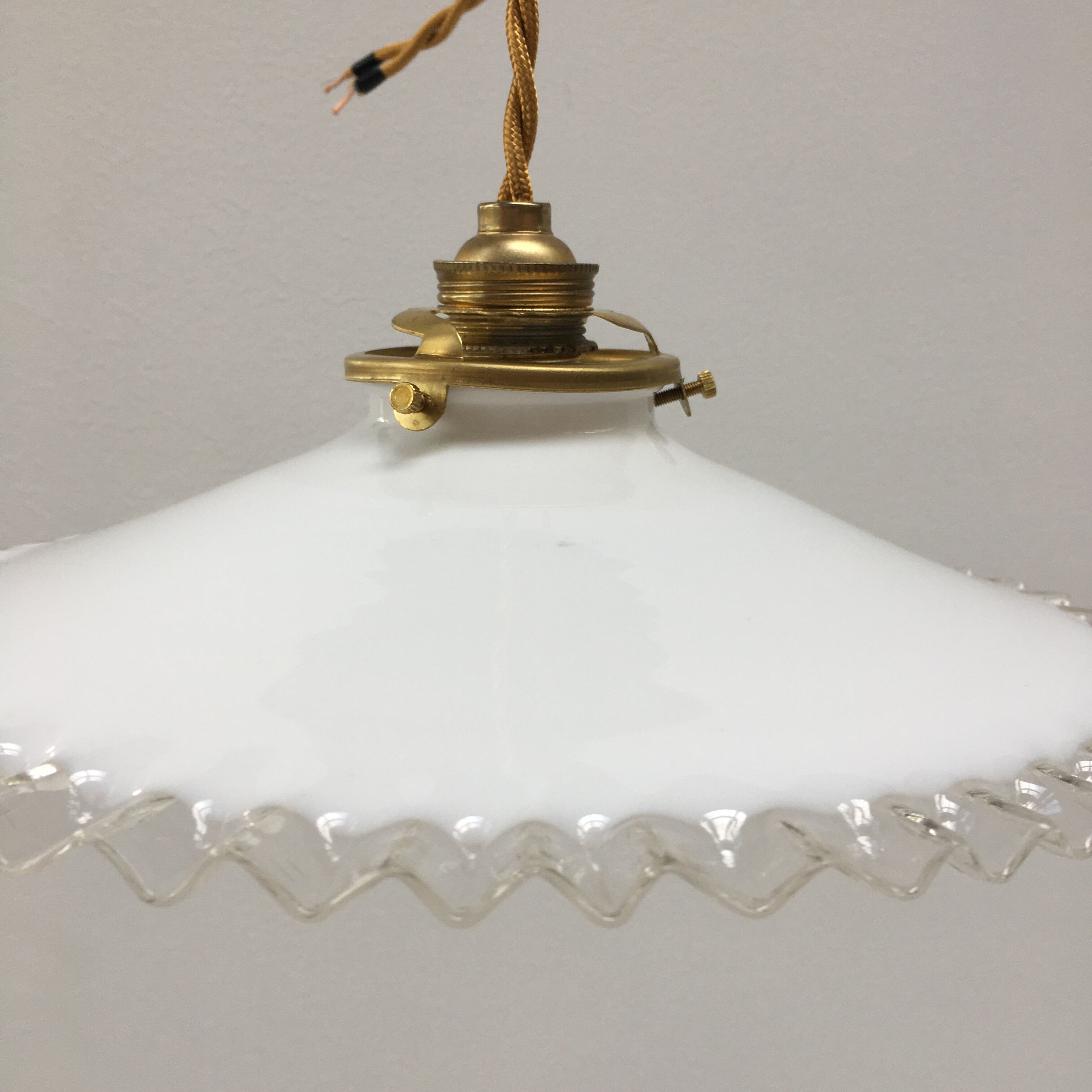 Pair of white opaline suspensions with serrated edges