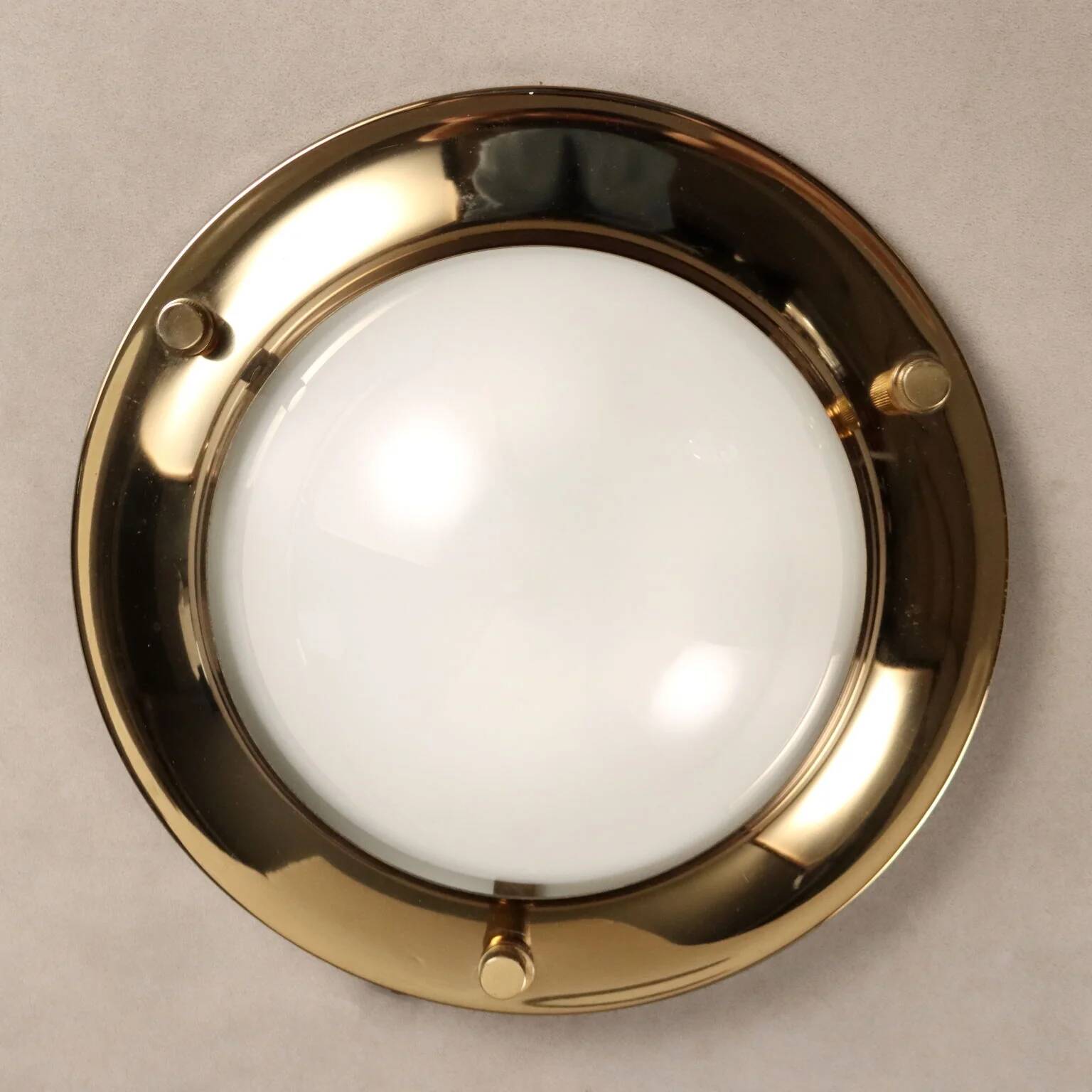 Vintage wall light in aluminium, brass, and glass, 1970s design.