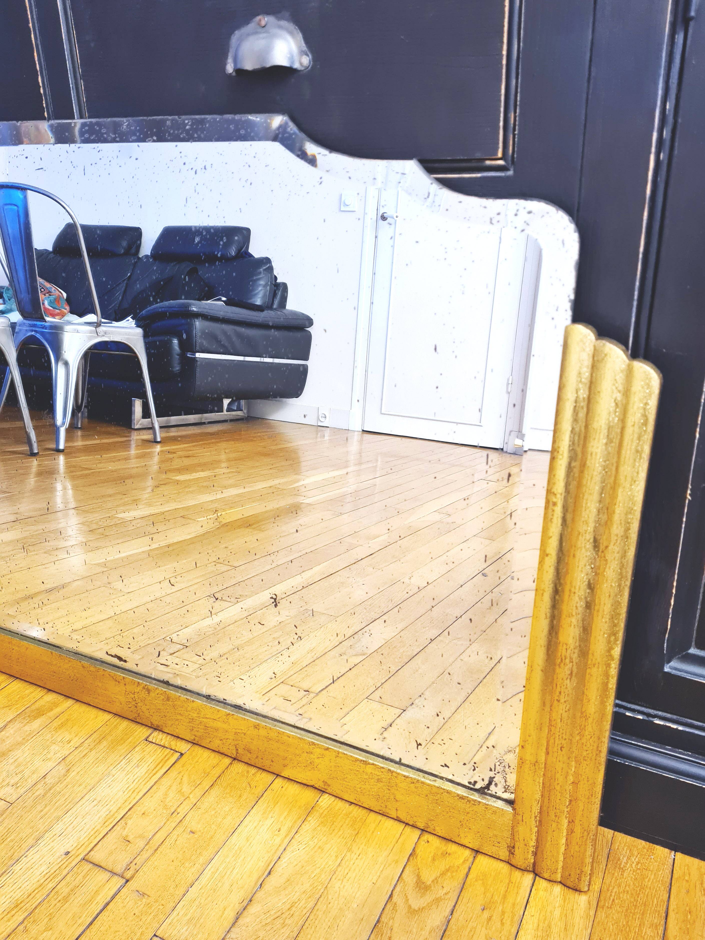 Antique large beveled mercury pediment mirror, art deco, gilded with leaf.