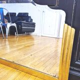 Antique large beveled mercury pediment mirror, art deco, gilded with leaf.