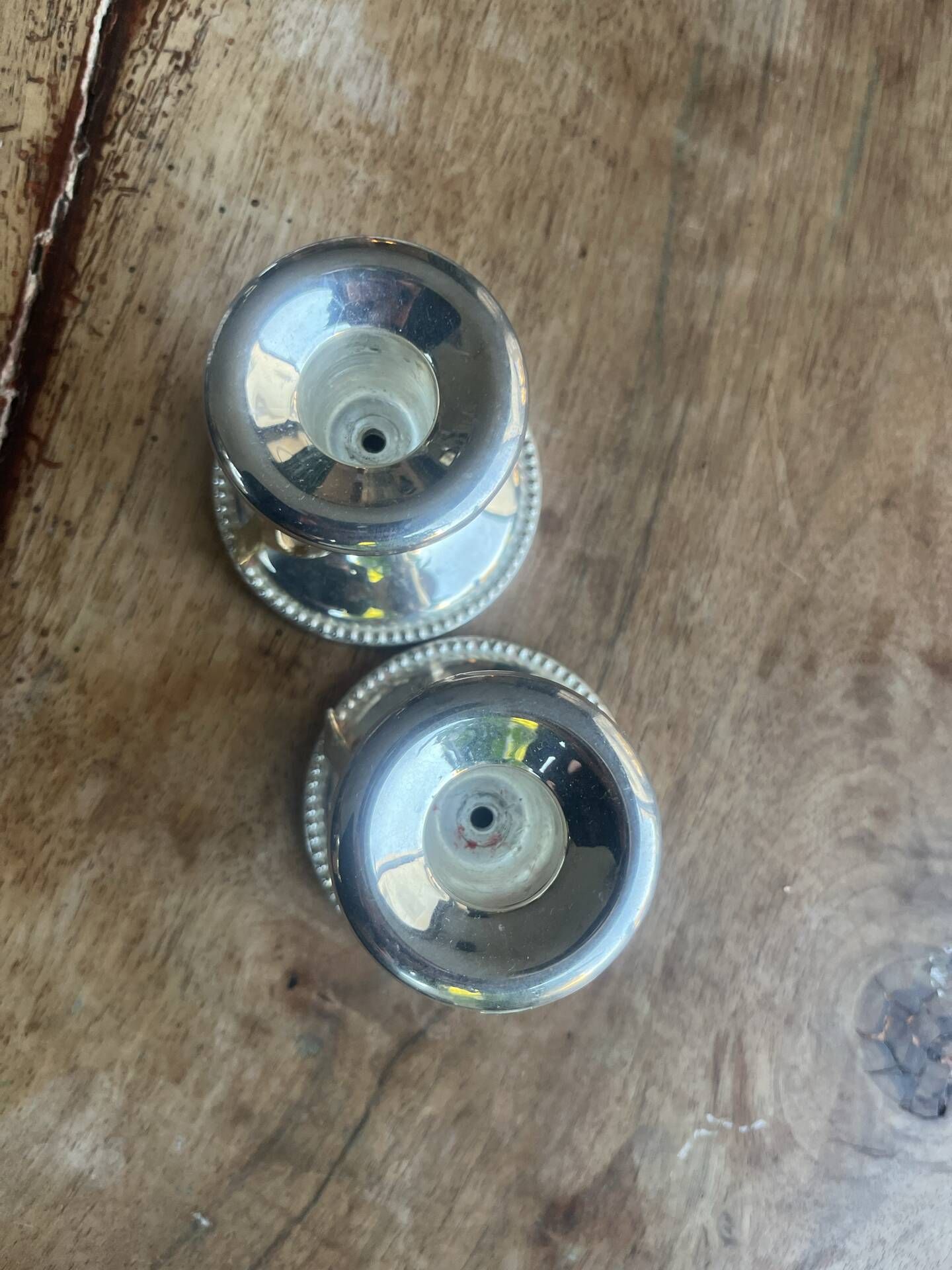 2 silver-plated candlesticks