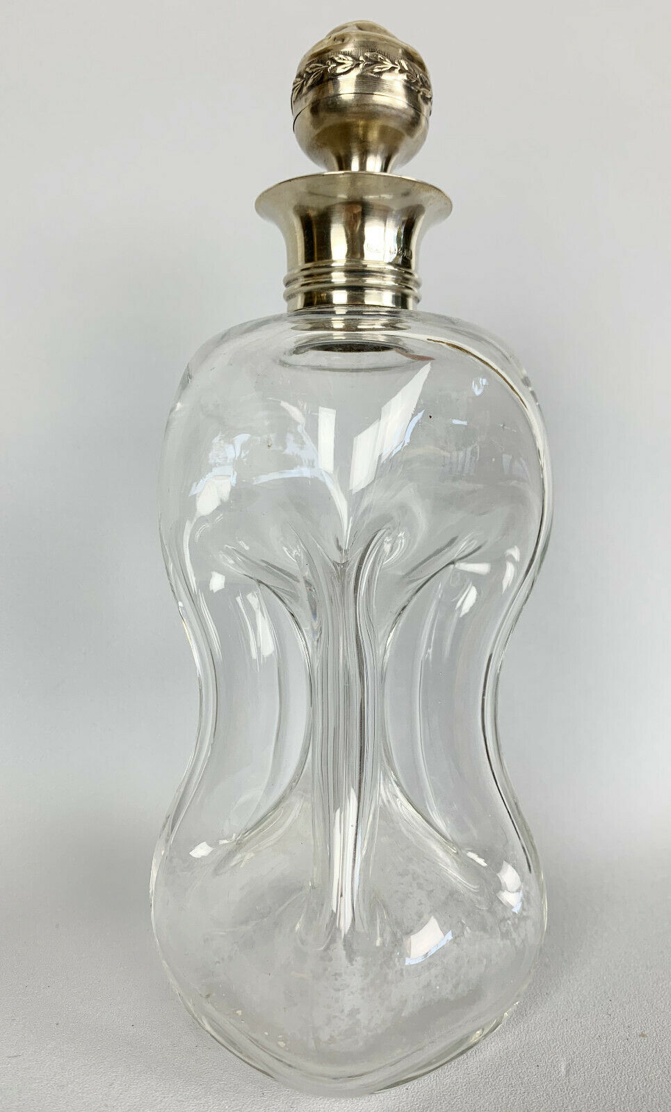 Blown glass carafe with silver frame and cap