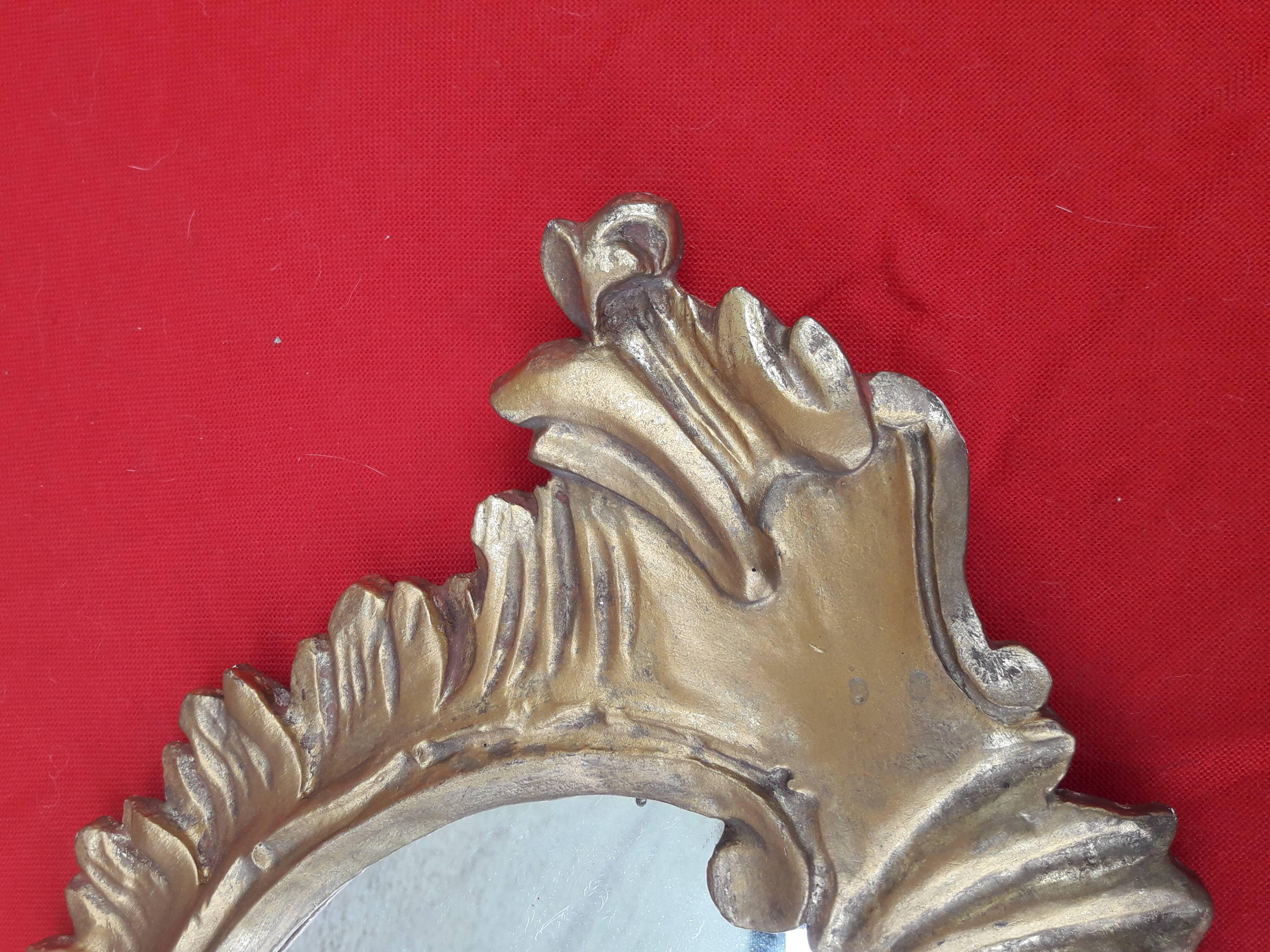 Louis XV style rocaille mirror in wood and gilded stucco