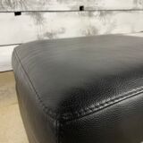 Black leather pouf