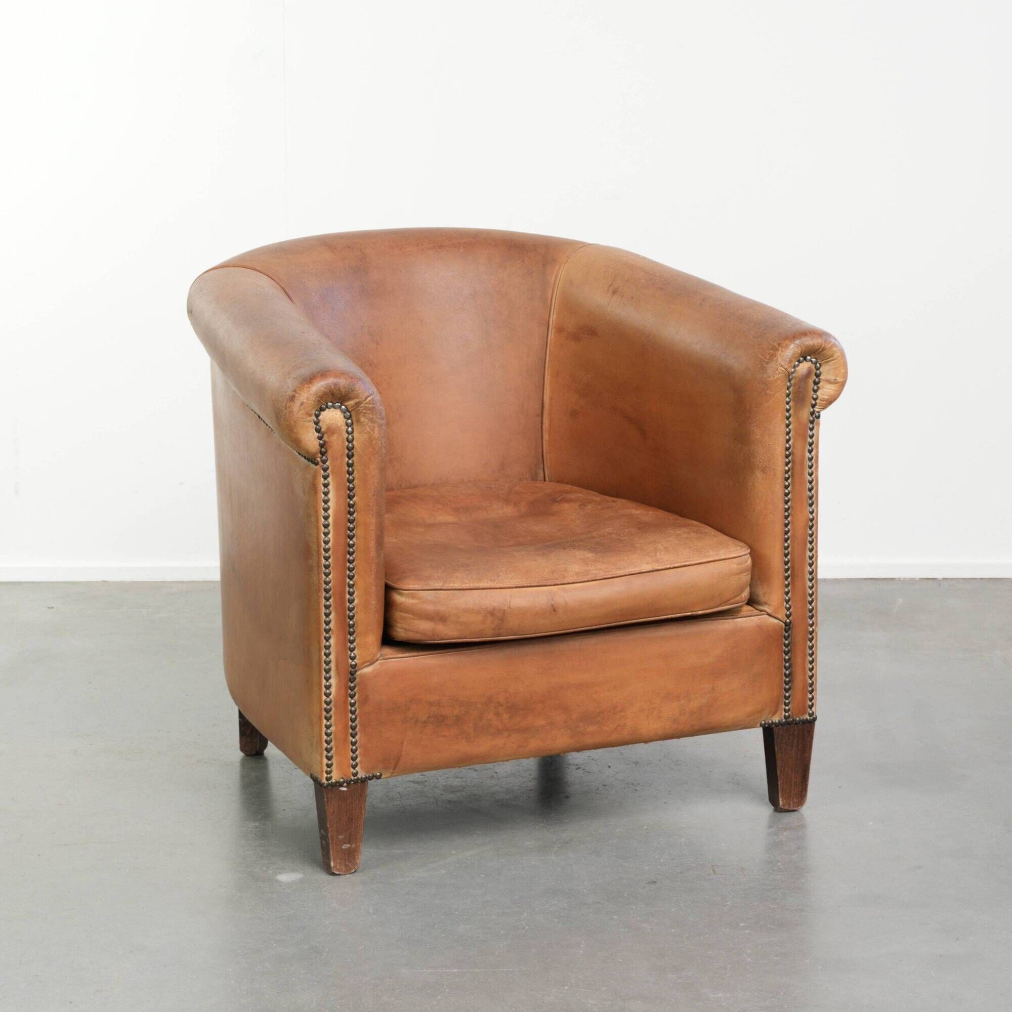 Vintage sheepskin club armchair in a beautiful light cognac colour