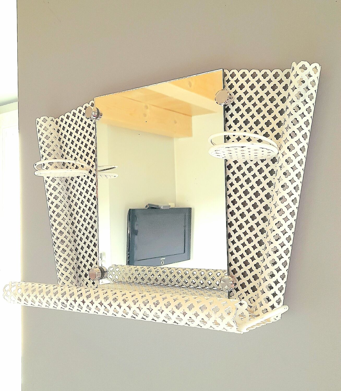 Perforated sheet metal bathroom shelf