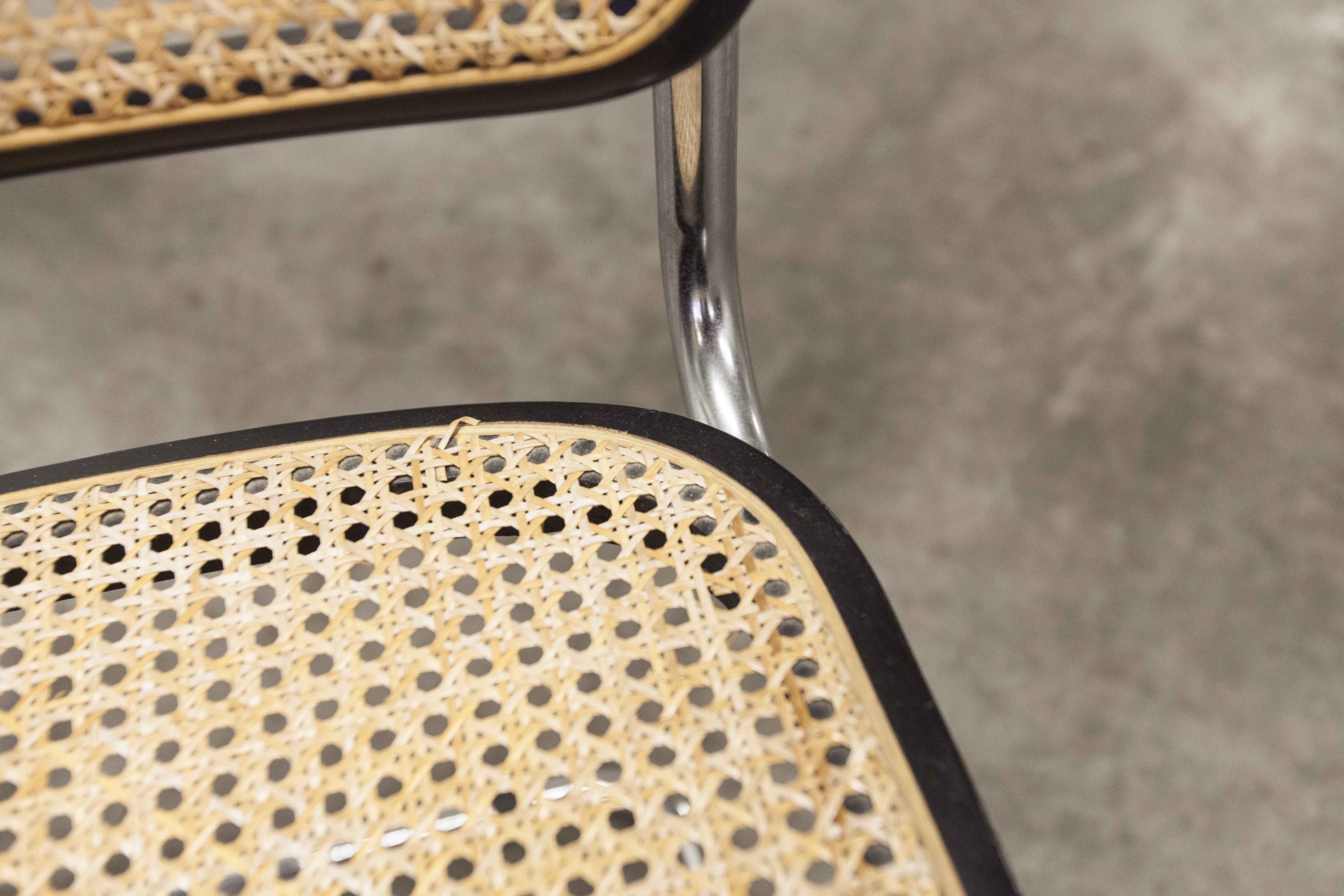 Pair of black Breuer b32 chairs and cannage