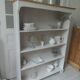 Bookcase in pearl grey waxed finish, light oak waxed top.
