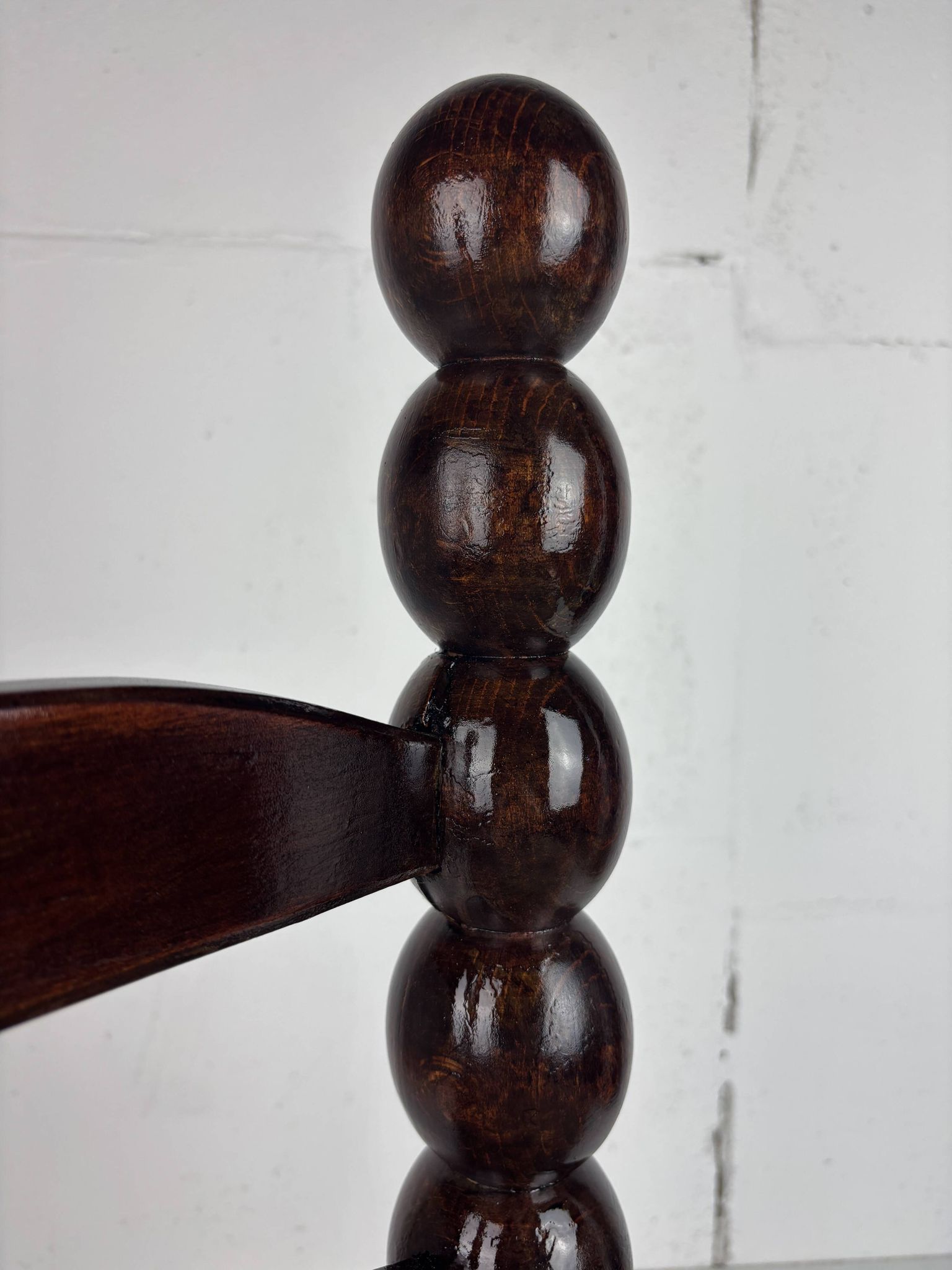 Brutalist wood turned bobbin low rush chair n the style of Charles Dudouyt