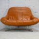 Sofa "space age". Leather, fiberglass, foam, steel. Circa 1970. Orange.